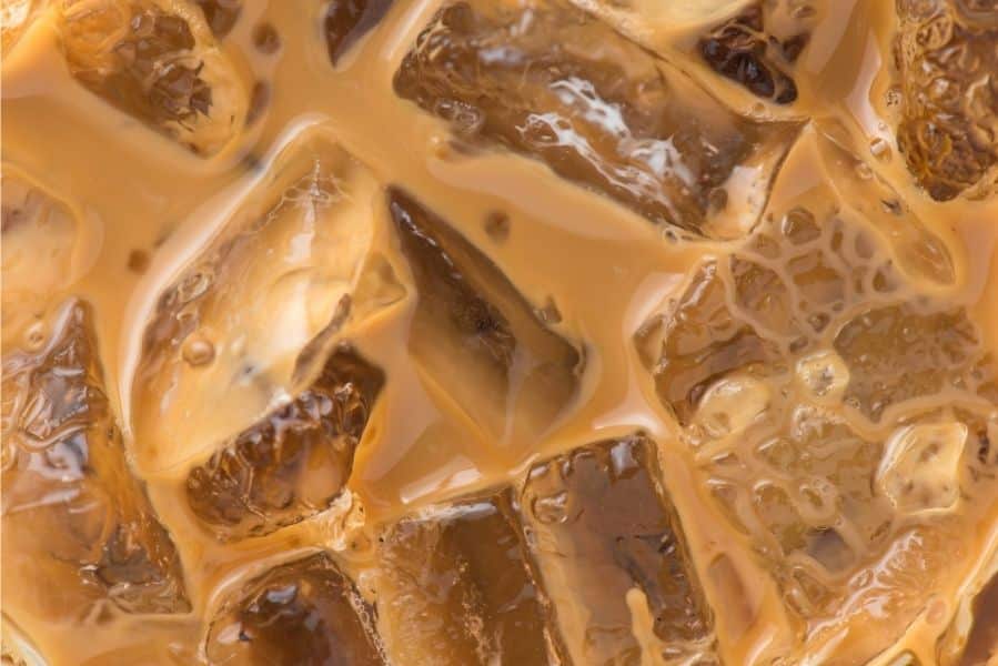 Close-up of creamy iced coffee with ice cubes, perfect for Austin's warm event days